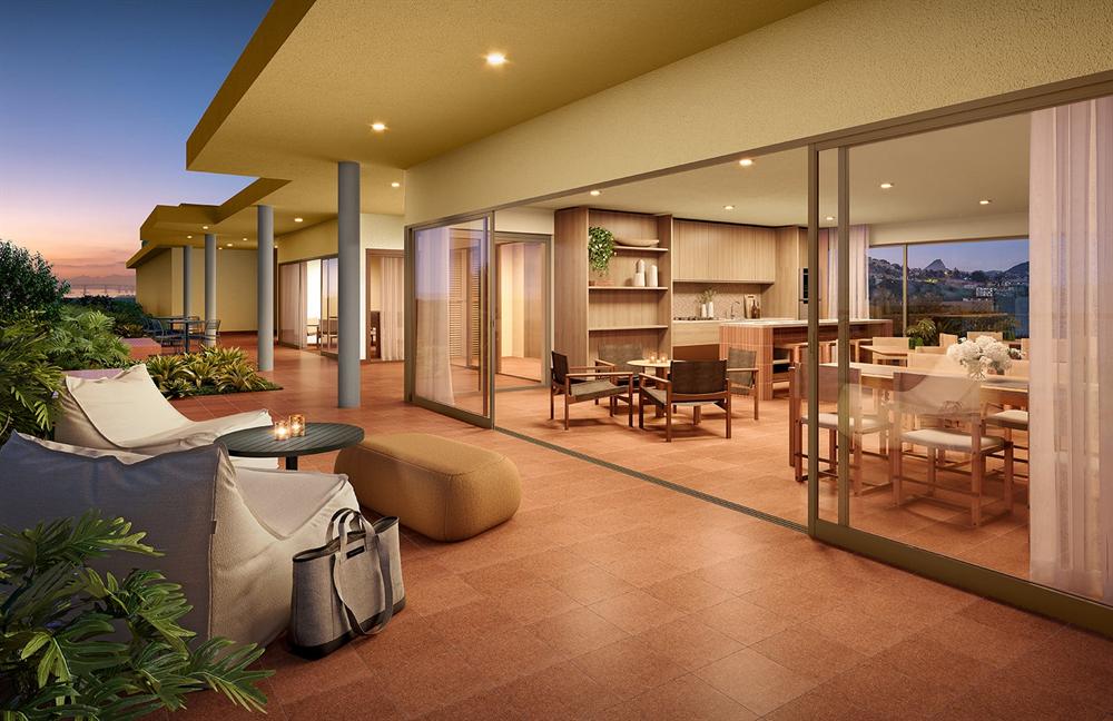 Lounge do rooftop do Residencial Erê ao entardecer